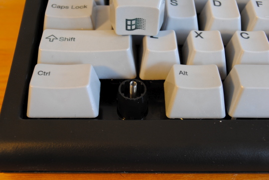 [pulled windows keycaps revealing spring]