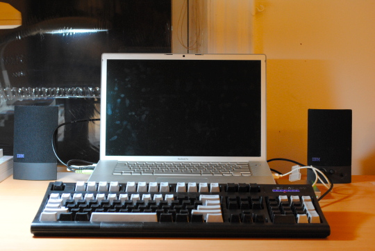 [MacBook Pro with speaker and keyboard]